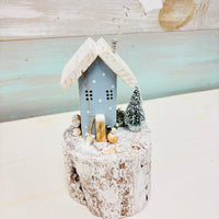 Assorted Winter Wooden Cottages on Driftwood Base