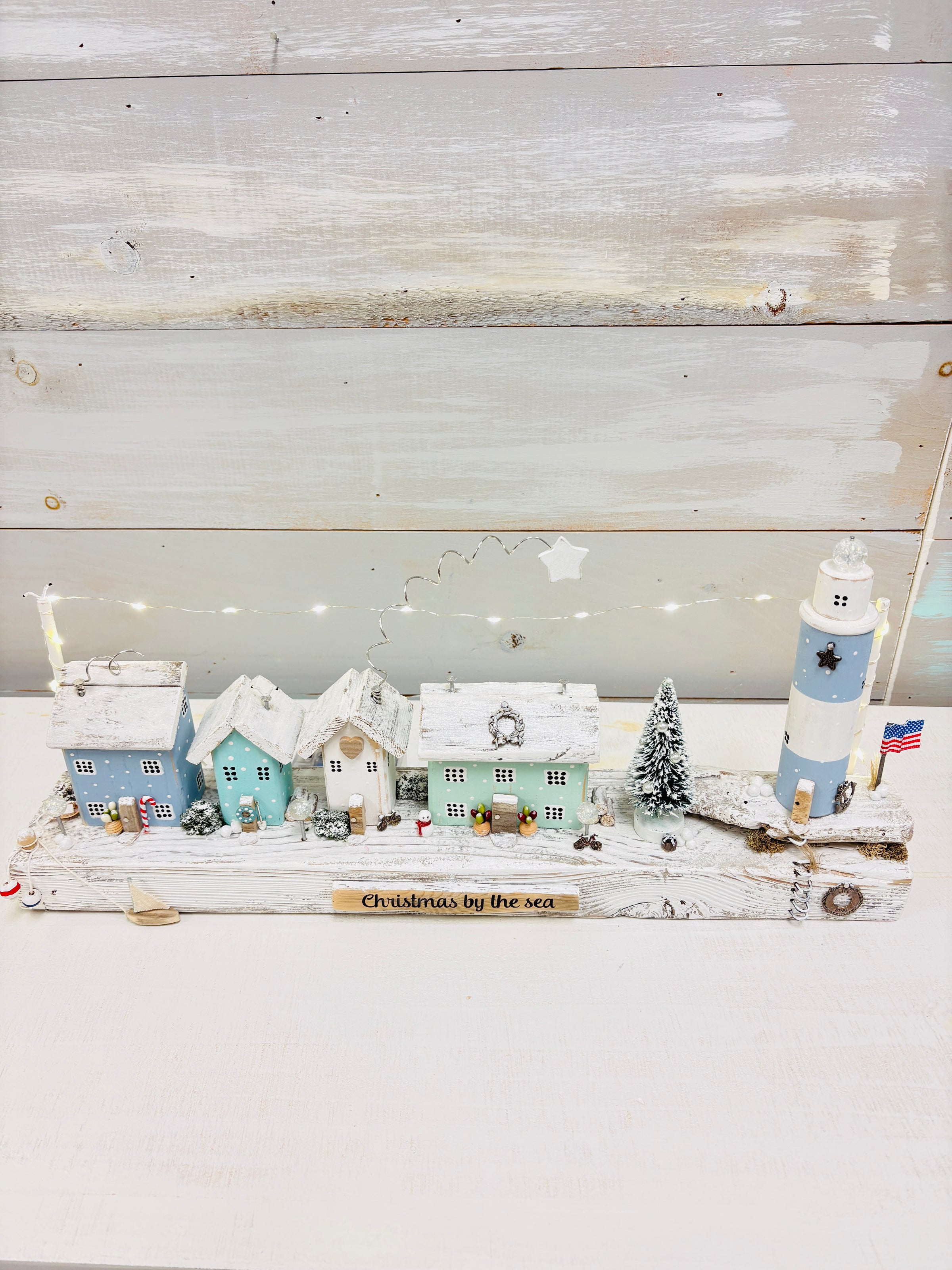 Christmas By The Sea Winter Cottage and Lighthouse Scene on Driftwood w/ String Lights