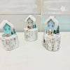 Assorted Winter Wooden Cottages on Driftwood Base
