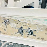 Turtle Hatchlings on Shore Framed Print