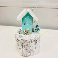 Assorted Winter Wooden Cottages on Driftwood Base