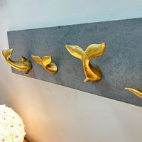 Resin Gold Leaf Whale Tail on Cement