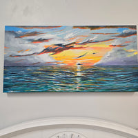Sunset over the water.