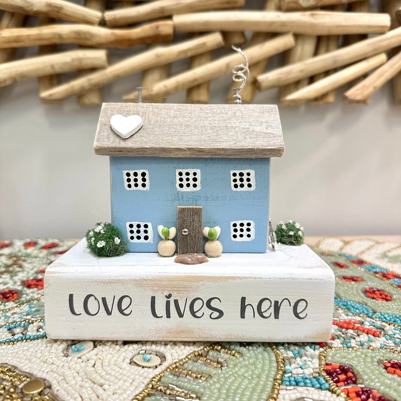 "Love Lives Here" Driftwood House