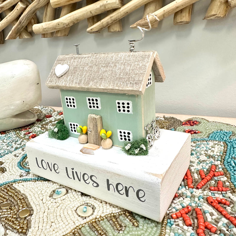 "Love Lives Here" Driftwood House
